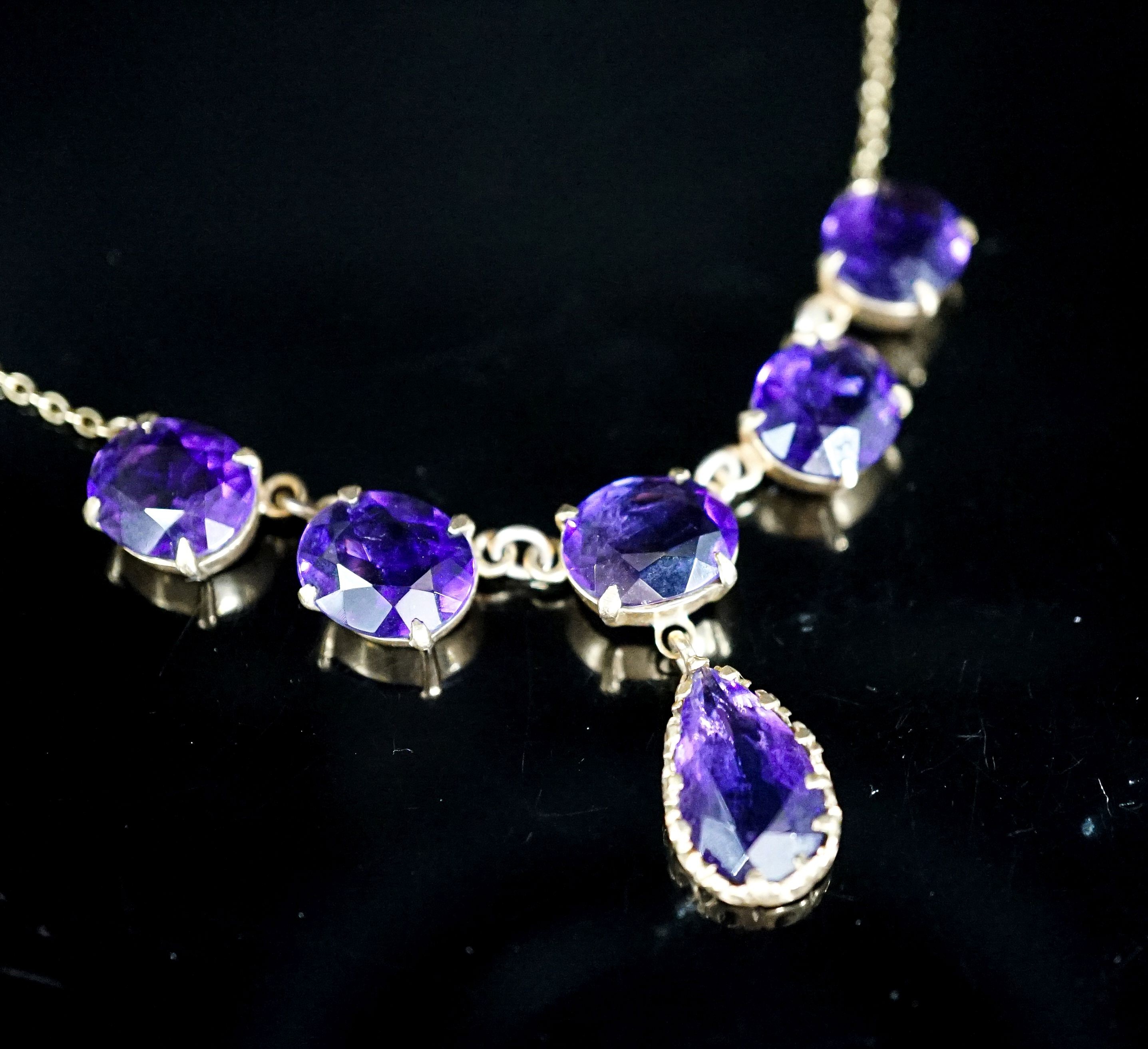 A 9ct gold and six stone oval and pear cut amethyst set drop necklace, 48 grams.7cm, gross weight 13.8 grams.